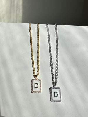 
                  
                    White Letter Necklace
                  
                