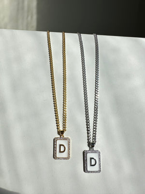 
                  
                    White Letter Necklace
                  
                